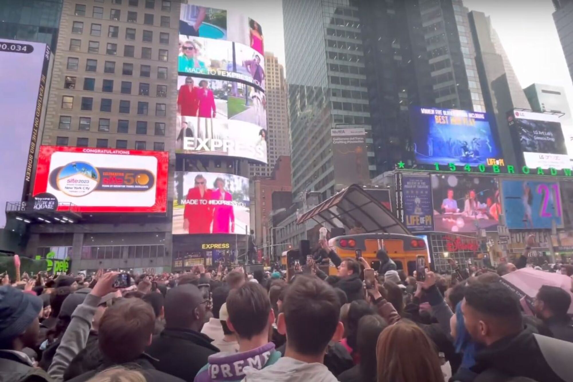 Wide shot of the crowd filling Times Square