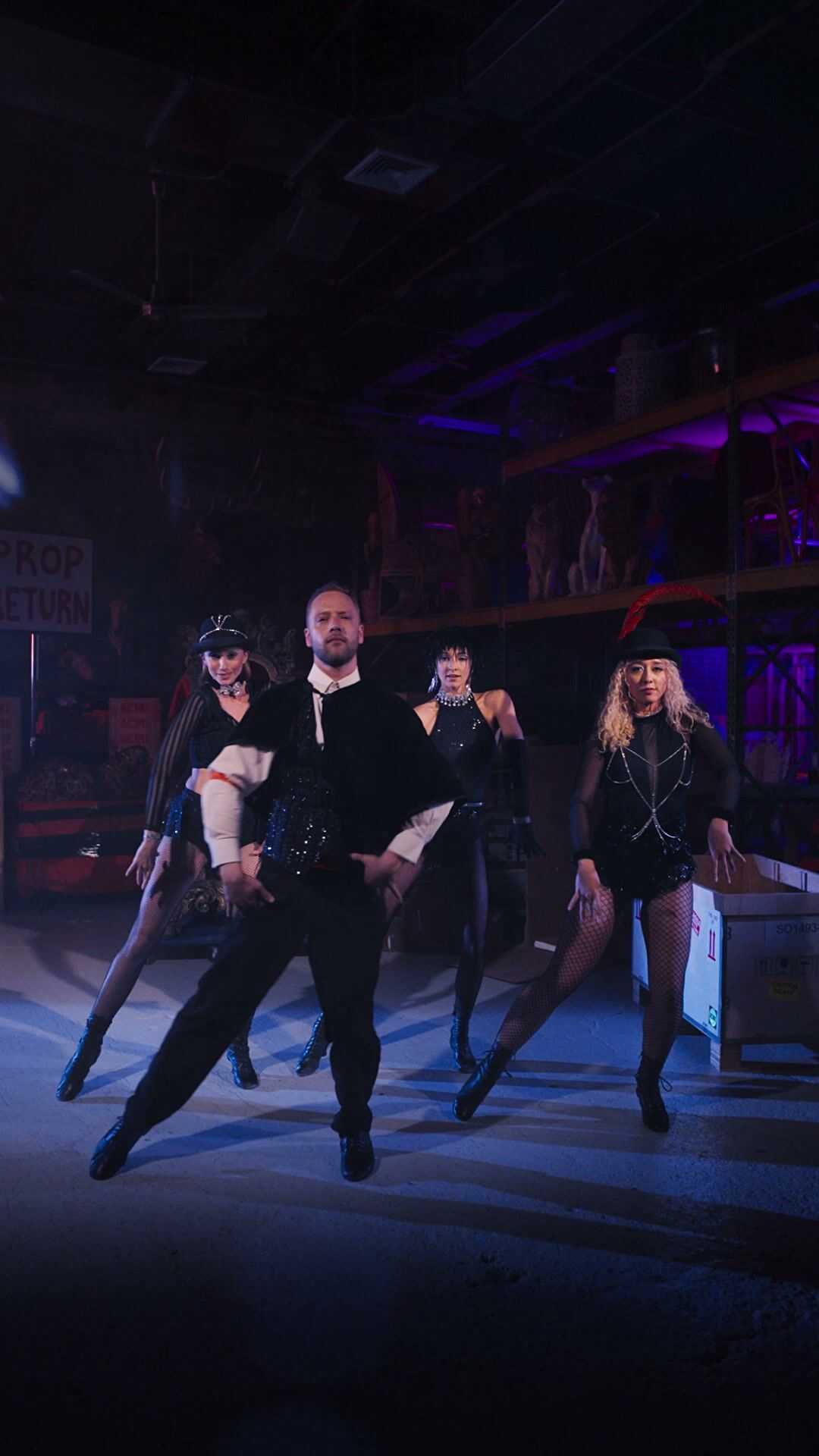 Ensemble dance number in the ACME warehouse