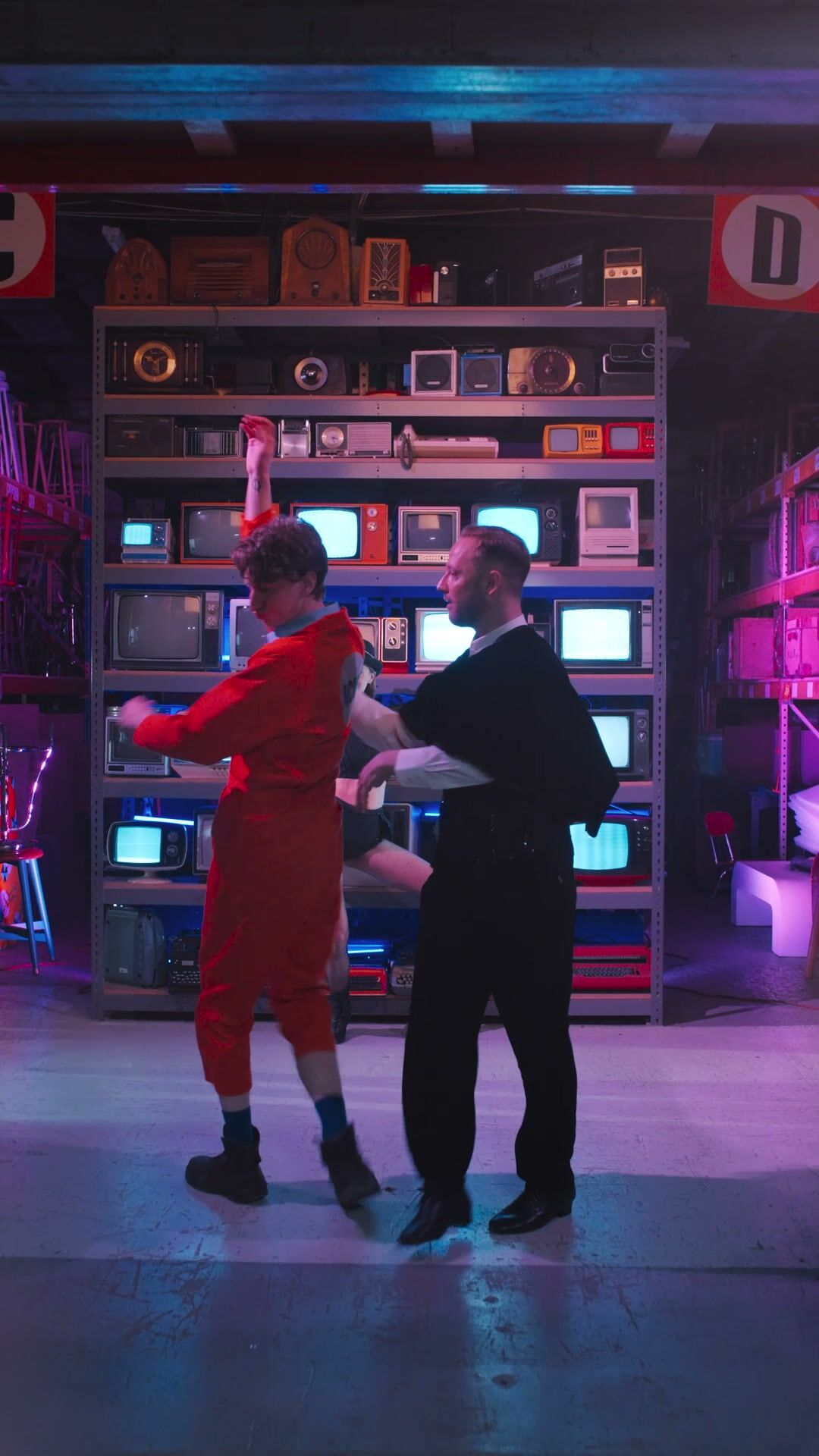 Duet in front of vintage TV wall