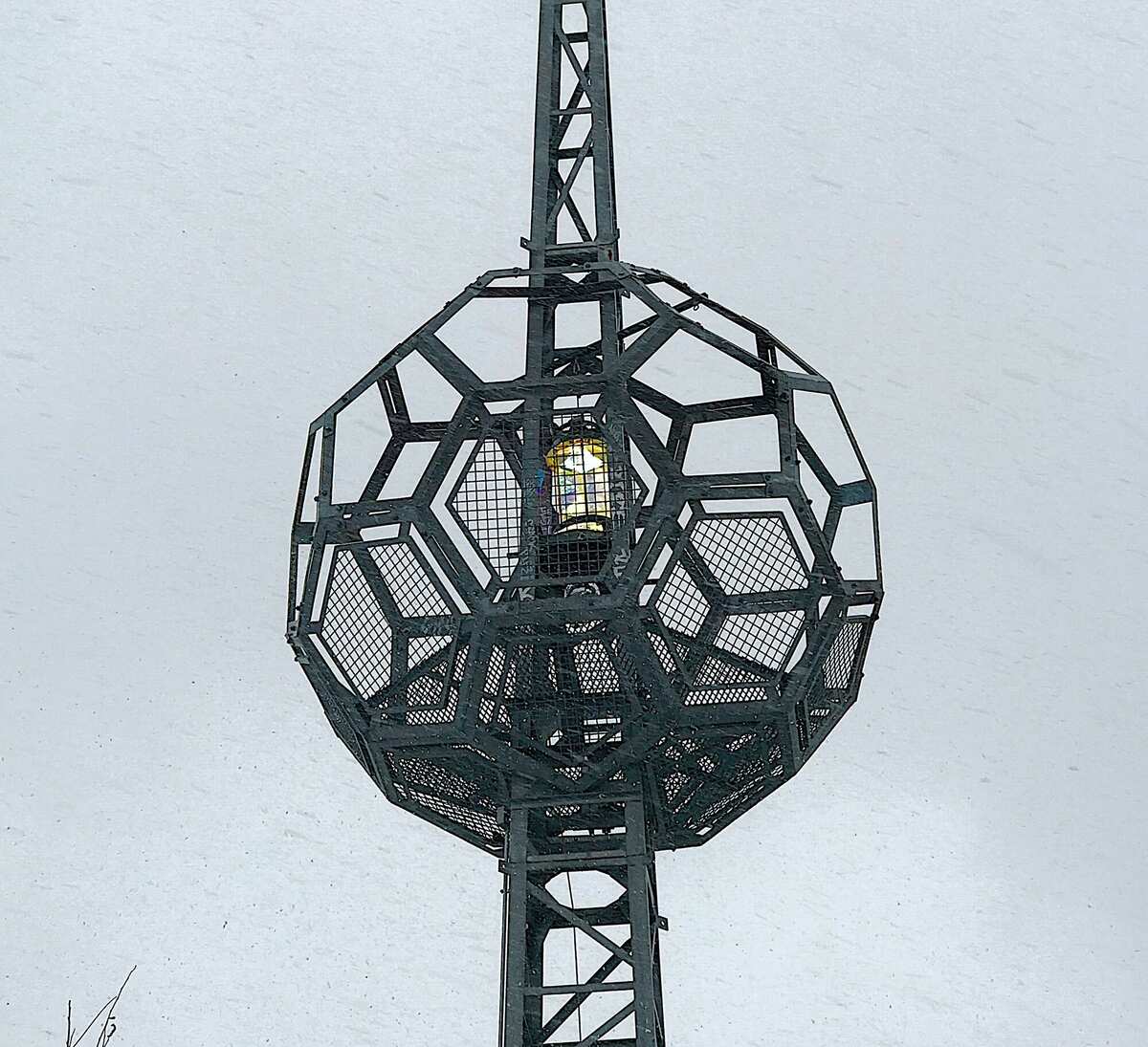 Warm light radiating through mesh panels from below