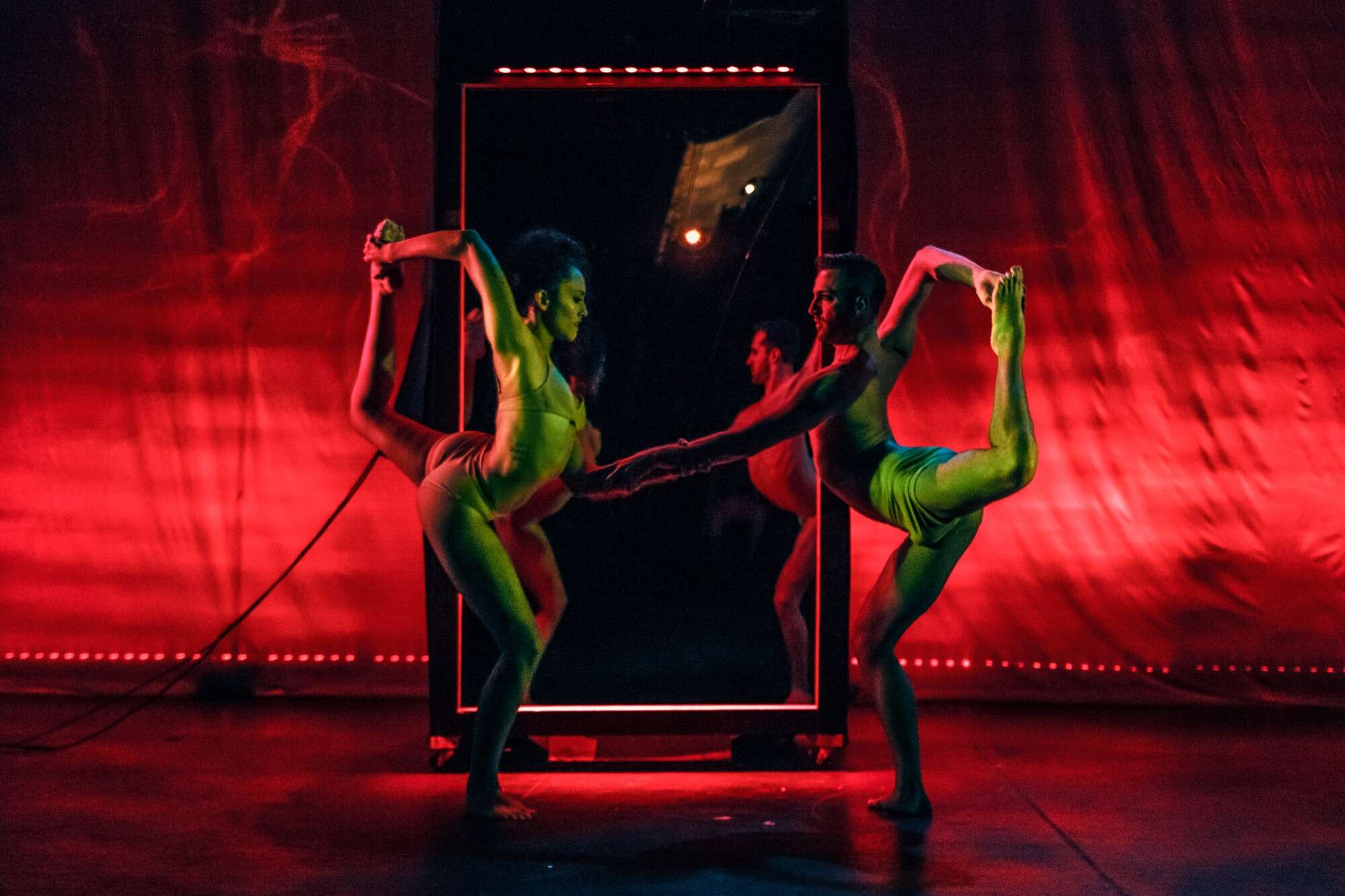 Red mirror booth with dancers