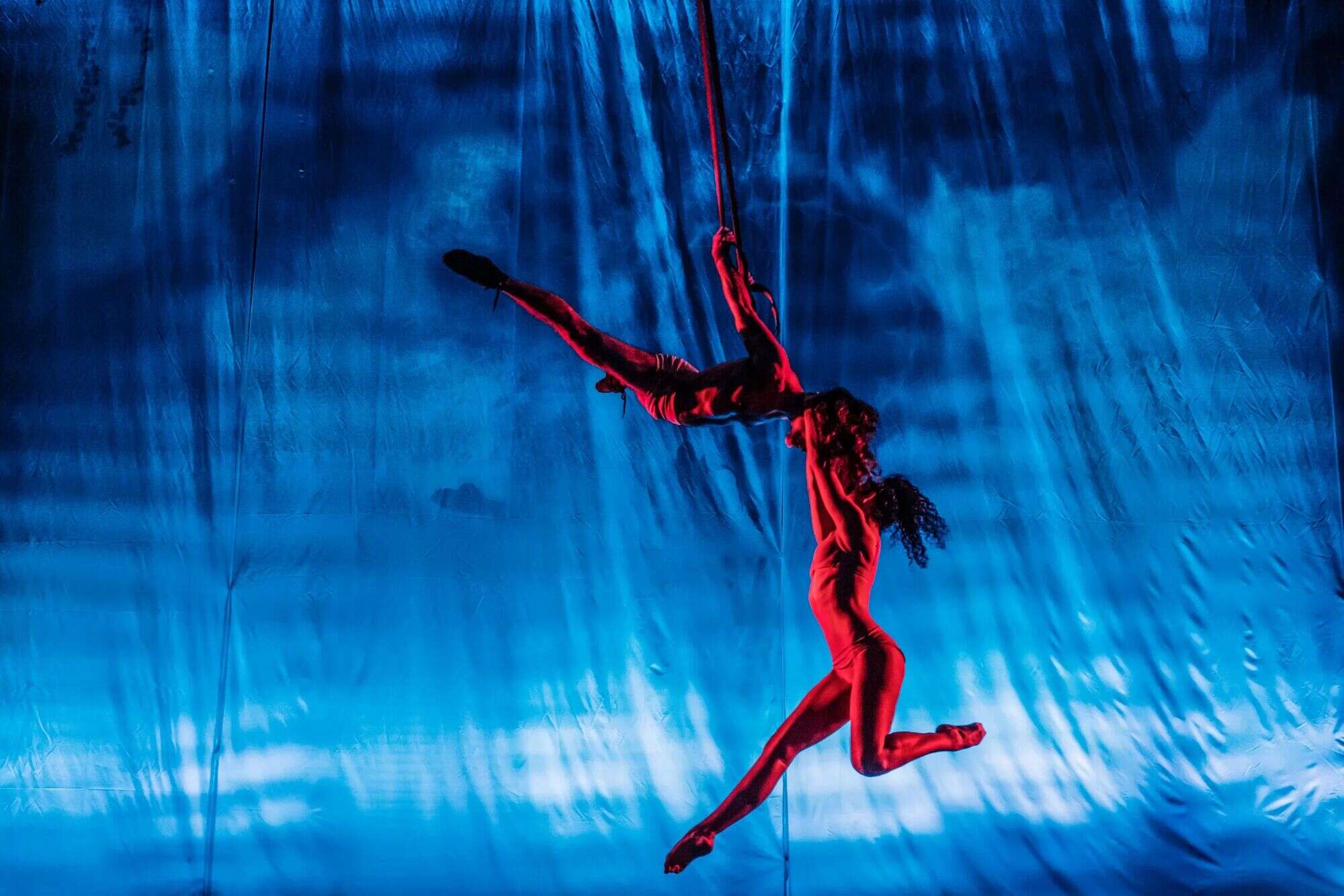 Aerial performer on blue