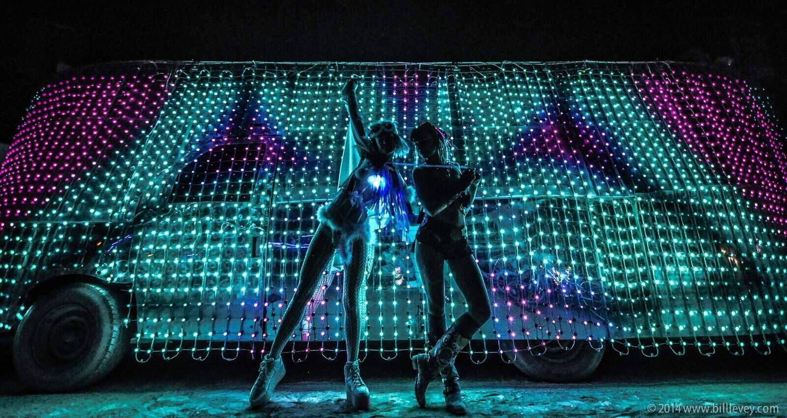 Dancers silhouetted against the LED skin