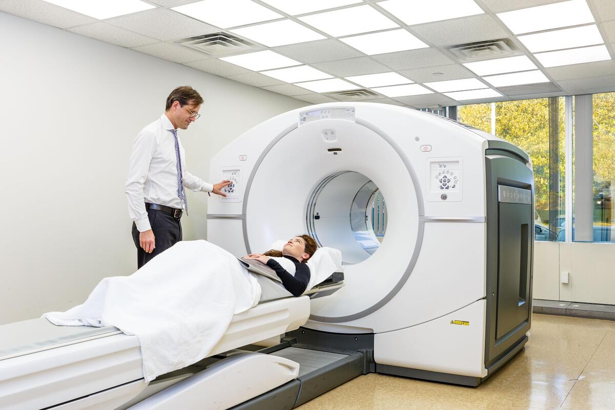 Doctor operating the PET/CT machine