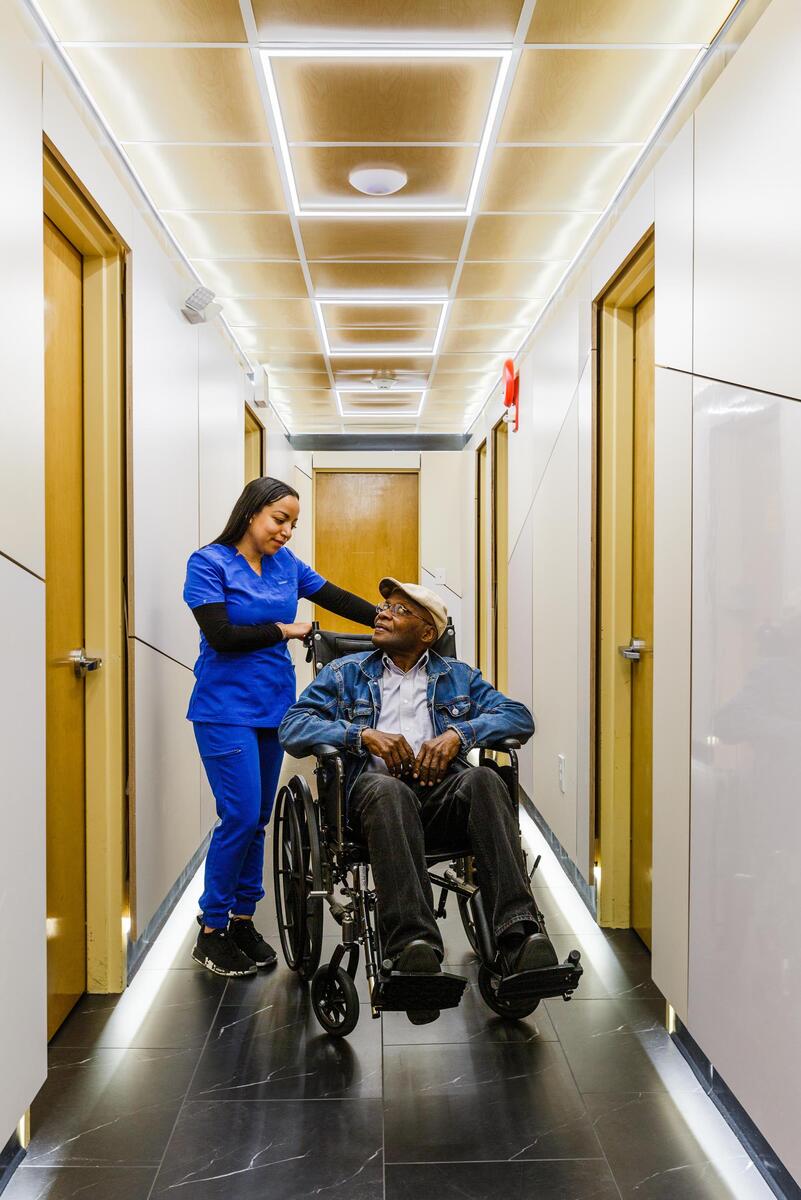 Patient being wheeled through the corridor